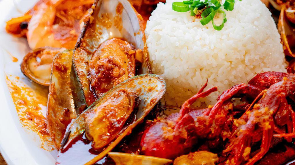 Cajun Seafood With Rice · Crawfish, shrimp, clams, mussels, and cajun sauce. Served with steamed rice.