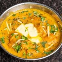 Chicken Makhanwala (Butter Chicken) · Tandoori boneless chicken cooked in mildly spiced tomato sauce.