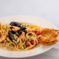 Seafood With Cream Sauce · fettuccine, heavy cream, onion, mushroom, bell pepper, shrimp, squid, mussel, masago, topped...