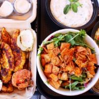 The Family Meal ($60 Value) · 10pc Marinated Grilled Chicken Tenders. With your choice of 3 Large sides. Served with pita ...