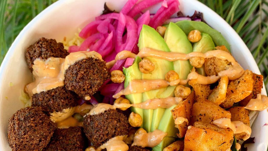 Falafel Bowl (Iconic Bowls)  · Falafel Minis, Salad, Rice, Hummus, Pita Croutons, Haus-Avocado, Pickles Red Onions, Chipotle Tahini Sauce.