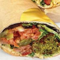 Falafel Wrap · Vegan. Toppings includes hummus, lettuce, tomato, pickles  & chipotle tahini.
