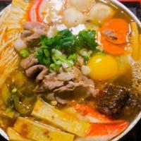 Tasty Lamb Hotpot · Napa, vermicelli, sliced lamb, sour master, tofu, carrot, crab stick, tempura, fish ball, ba...
