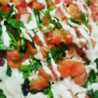 Nachos · Choice of meat
Topped with beans cheese, special cream sauce, onion, cilantro, tomato, avocado