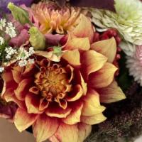 Seasonal Hand Wrapped Farm Bouquet · The best of what is blooming on the farm, hand wrapped in our classically sustainable farm s...