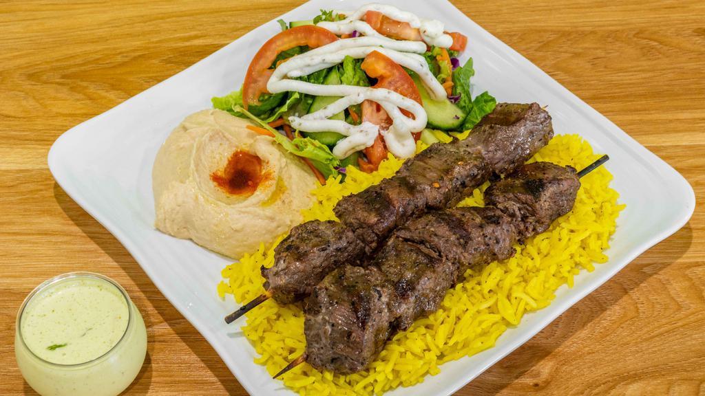 Beef Kabob · Two skewers of delicious marinated charbroiled beef.