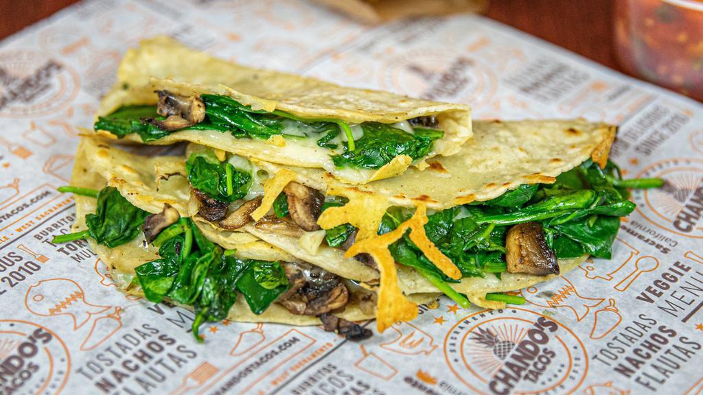 Spinach Taco · Perfectly sautéed spinach, onions, cheese, and mushrooms topped with fresh cilantro, delicious diced onions, creamy guacamole, and tangy salsa.