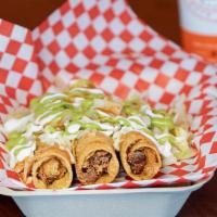 Chicken Flautas · Shredded chicken rolled up in a tortilla fried, topped with fresh lettuce, sour cream, chees...