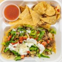 Tostada · beans, lettuce, tomato, cheese, sour cream, hot or mild salsa, your choice of meat.