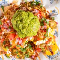 Rr Loaded Nachos · Crispy tortilla chips smothered in house made Russian River beer cheese, bacon, guacamole, t...