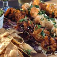 Shrimp Trio · 18 Jumbo Prawns smothered in 3 of our sauces: 6 Craft Beer-Battered, 6 Garlic Buttered, 6 Th...