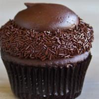 Chocolate Cupcake · Rich and moist chocolate cake, topped with decadent chocolate butter cream, edged in chocola...