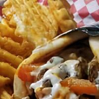 Gyro Philly Meal  · Lamb & Beef mixed gyro with grilled onions, bell peppers, and cheese, topped with house ranc...