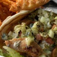 Chicken Wrap Meal  · Grilled Chicken breast served with lettuce, veggies, tzatziki, and chutney sauce on pita bre...