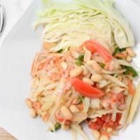 Papaya Salad (Thai) · Shredded green papaya mixed with fresh garlic, dried shrimp, tomato, green bean, chili lime ...