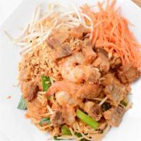 Pad Thai · Traditional stir-fried Rice noodle with eggs served with ground roasted peanut, raw bean spr...