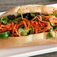 Banh Mi - Beef · BBQ marinated beef grilled and served in a hot toasted fresh French baguette with cilantro, ...