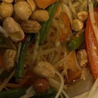 Papaya Salad · Spicy. Contains Peanuts. Shredded green papaya, tomato, green beans, carrots and peanuts wit...