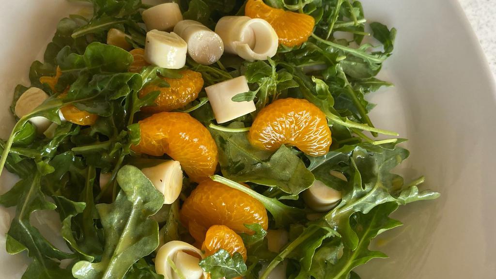Hearts Of Palm Arugula Salad · Hearts of palm, arugula and tangerine served with orange vinaigrette