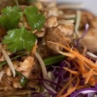 Pad Thai · Contains Peanuts. Stir-fried thin rice noodles with carrots, green onions, red onions and be...