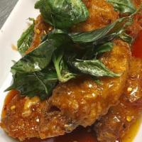 Spicy Hot Wings · Deep-fried chicken wings served with homemade spicy hot sauce.