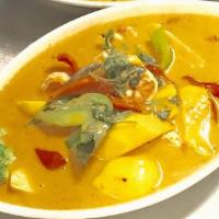 Mango Or Pumpkin Curry · Creamy red curry sauce come with chicken and shrimp, bell peppers, Thai basil and coconut mi...