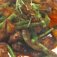 Prik King · Sautéed green beans with bell peppers and spicy red curry paste.