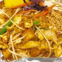 Pad Thai · Thai style pan fried thin rice noodle with eggs, tofu, bean sprouts, green onions, fresh lim...