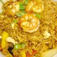 Pineapple Fried Rice · Pan fried rice with egg, pineapple, carrot, cashews, raisins, onions, curry powder and fresh...