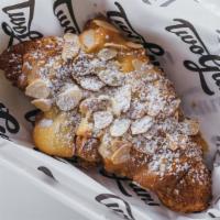 Almond Croissant · Butter Croissant filled with almond pastry cream, with almonds and powdered sugar on top