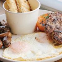 Breakfast Plate · Two eggs any style, maple breakfast sausage, mushroom gravy, smashed potatoes, tomato, rusti...