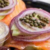 Sliced Nova Lox · open face bagel lox cream cheese 
tomato ,onion cucumber 
capers optional MUST REQUEST