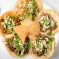 Tacos · Come with onions cilantro and red or green salsa.