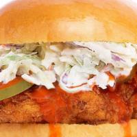 Buffalo Fried Chicken Sandwich · Fried chicken breast tossed in buffalo sauce, tasty sauce spread, creamy coleslaw, and pickl...