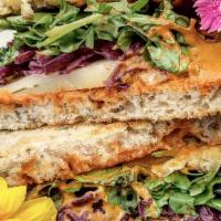 Tempeh Reuben · Vegan chipotle aioli, tempeh, manchego, sauerkraut, arugula on Jewish rye bread.