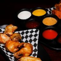 Large 10 Pc Wing Combo
 · 10 Boneless or Classic (Bone-In) wings with up to 2 flavors, regular fries , 1 dip and a drink