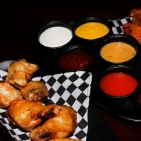 Medium 8 Pieces Wing Combo · 8 boneless or classic (bone-In) wings with up to 2 flavors, regular fries, 1 dip and a drink.