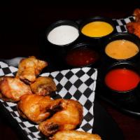 Wings (50) · 50 boneless or classic (bone-in) wings with up to 4 flavors.