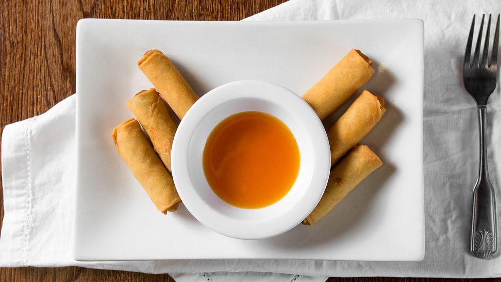 Fried Spring Rolls · Six (6) pieces. Wrapped vegetarian rolls of cabbage, carrot and glass noodles, served with sweet and sour sauce.