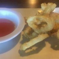 Calamari Tempura · Deep fried calamari in a light batter, served with sweet and sour sauce.