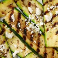 Grilled Zucchini · Vegetarian. 4-5 pieces of zucchini with feta cheese, olive oil and lemon.