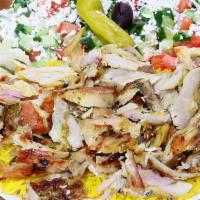 Shawarma Plate · Served with yellow rice, Greek salad, hot pita and fresh cut marinated chicken. Tzatziki and...