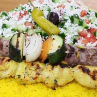 Chicken And Beef Tikka Plate · Served with yellow rice, Greek salad, hot pita, 1 skewer of vegetable and skewers of chicken...