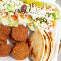 Falafel Plate · Vegetarian, vegan, dairy-free. Served with 8 pieces of falafel, Greek salad, hot pita and hu...