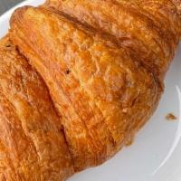 Croissant · The classic crescent-shaped pastry made from flaky layers of buttery dough, baked to order e...