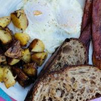 Basic B*Tch Breakfast · Eggs any style, bacon, herb roasted potatoes, sourdough toast.