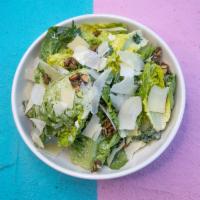 It'S A Caesar · Little gems, crunchy pepitas, parsley, cilantro, shaved parmesan and pumpkin seed caesar dre...