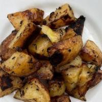 Roasted Potatoes · Herb-roasted quartered potatoes
