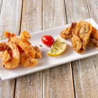 Oyster & Shrimp Combo · A medley of 5 oysters and 6 shrimp served grilled or fried with two sides.  Option to make i...