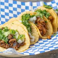 Street Taco · Served with homemade corn tortilla, cilantro, and onions.